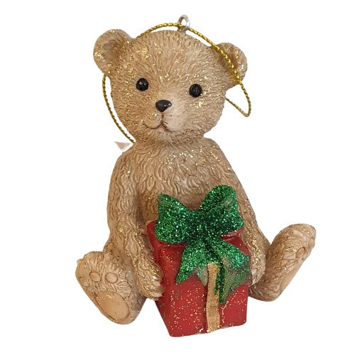 Figurine ours assis avec paquet cadeau
